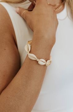 Anyone else wish they were at the beach right now? The Beachy Bracelet can always bring the beach to you wherever you may be. This handmade bracelet has several shell details in a line with a slide clasp to make putting on and taking off easy. Beachy Bracelet-Natural, boutique clothing, casual, the perfect accessory! Boutique Clothing Cheap Bohemian Bracelets For Beach, Cheap Silver Bracelets For Beach, Affordable Casual Beach Wrap Bracelet, Cheap White Bracelets For Beach Party, Cheap Casual Crystal Bracelet For Beach, Cheap Gold Bracelets For Beach, Cheap Bohemian Bracelet For Beach, Affordable Multi-strand Bracelets For Beach, Casual Cheap Crystal Bracelet For Beach