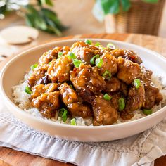 a white bowl filled with chicken and rice