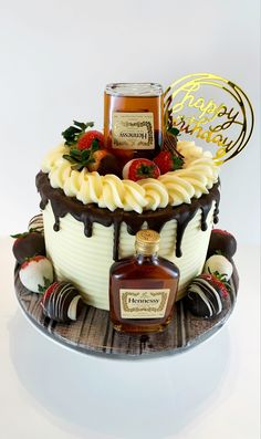 a birthday cake decorated with strawberries, chocolate and honey for someone's special occasion