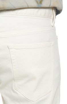 Crisp white Japanese-denim jeans are cut in a skinny fit with a hint of stretch that allows you to move freely and comfortably in these five-pocket jeans. 32 1/2" inseam; 13" leg opening; 10 1/2" front rise; 14" back rise (size 32) Zip fly with button closure Five-pocket style 98% cotton, 2% polyurethane Machine wash, line dry Made in Japan Men's Clothing White Straight Everyday Bottoms, Classic Mid-rise Cream Bottoms, White Straight Fit Everyday Jeans, White Straight Fit Jeans For Everyday, Classic White Bottoms For Everyday Wear, Classic White Everyday Bottoms, White Straight Fit Denim Bottoms, Classic Cream Jeans With Five Pockets, Classic White Straight Fit Jeans