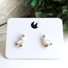 Goose earrings studs made from highly durable plastic with gloss finish.  Posts are nickel free and hypoallergenic titanium, excellent for sensitive ears.  Geese measure approx 10mm. // Info: * Titanium posts * 100% Nickel-free * Hypoallergenic for sensitive ears * Ultra lightweight! We always include a pair of spare rubber backings with each order. ♥ // Stud earrings by PitterPatter: https://www.etsy.com/shop/PitterPatterPolymer?ref=seller-platform-mcnav&section_id=15736817 Goose Earrings, Shrinky Dink Earrings, Shrinky Dink, Silly Goose, Titanium Earrings, Shrink Plastic, Earrings Studs, Sensitive Ears, Etsy Earrings