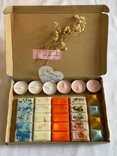 a box filled with different types of soaps