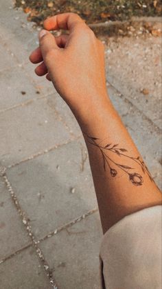 a person with a small tattoo on their arm