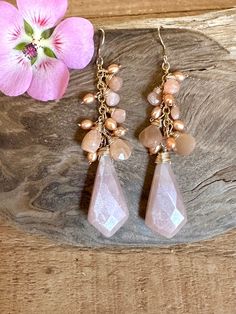 Gold filled dangle earrings with tan freshwater pearls and faceted peach moonstone gemstones Peach Teardrop Jewelry For Gifts, Handmade Peach Dangle Jewelry, Handmade Blush Jewelry For Gifts, Elegant Handmade Blush Jewelry, Elegant Faceted Moonstone Earrings, Elegant Pink Earrings With Faceted Beads, Peach Pearl Drop Jewelry Gift, Peach Pearl Drop Jewelry As Gift, Elegant Rose Gold Jewelry With Faceted Beads