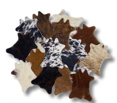 several different colored cow hides are arranged in the shape of an animal's head