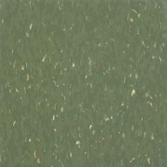 an image of a green background with small speckles on the top and bottom