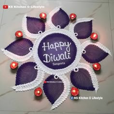 happy diwali greeting card with purple leaves and red candles on marble background for diwali festival