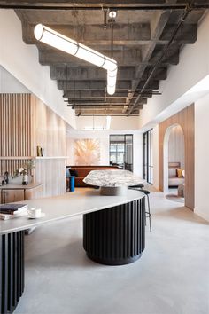 an office with large white counter tops and wooden walls