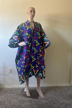 Discover bold styles with our ready-to-wear one-size-fits-all Quality African Print Kimonos, Handmade from premium cotton and perfect for all events. One Size Patterned Long Sleeve Kimono, Patterned Cotton Kimono With Kimono Sleeves, Multicolor Cotton Outerwear With Kimono Sleeves, Multicolor Long Sleeve Oversized Kimono, Multicolor Oversized Long Sleeve Kimono, Oversized Long Sleeve Multicolor Kimono, Oversized Multicolor Long Sleeve Kimono, Multicolor Printed Long Sleeve Robe, Multicolor Long Sleeve Printed Robe