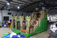 an inflatable castle is set up inside a warehouse