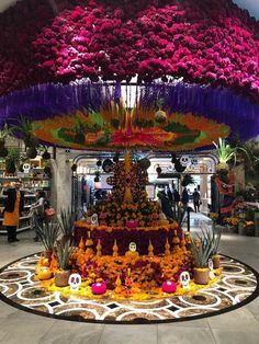 an elaborate display in a store filled with lots of flowers