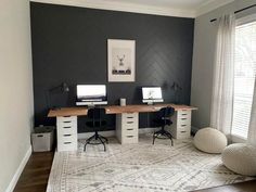 a home office with two desks and chairs