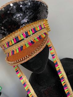 Dazzle Tassel is bringing the festival vibes once again and we love her! Black sequins, gold studs and multicoloured tassels. Handmade with all your celebrations in mind. Any questions, just ask. 💜 Hat circumference 23 inches / 60 centimetres Carnival Celebration Adjustable Headpieces, Adjustable Headpieces For Carnival Celebration, Multicolor Festival Headpieces For Summer, Adjustable Multicolor Headpieces For Summer, Bohemian Gold Headpiece For Party, Handmade Gold Headpieces For Party, Bohemian Headpieces For Carnival Festival, Adjustable Festival Headpieces For Parties, Bohemian Gold Carnival Headpiece