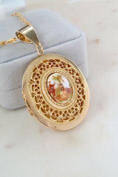 "Vintage Victorian Locket Necklace. Length: 2 3/4\" Width: 1 1/2\" Chain length:  18\" Vintage condition! Discolored please zoom in. Back to the shop: https://www.etsy.com/shop/SusVintage?ref=hdr_shop_menu Don't hesitate to contact me if you have any further questions. Thank you for looking!!" Oval Enamel Locket Necklace, Oval Locket Necklace In Enamel, Antique Oval Enamel Necklaces, Vintage Enamel Oval Pendant Jewelry, Antique Oval Enamel Necklace, Ornate Oval Enamel Jewelry, Vintage Oval Enamel Jewelry, Vintage Enamel Oval Pendant Necklace, Locket Necklace Picture