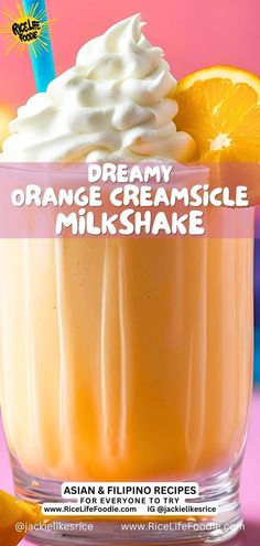 an orange creamsice milkshake with whipped cream on top