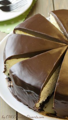 a chocolate cake on a plate with one slice cut out and the other half eaten