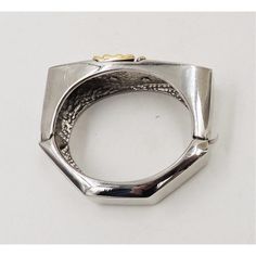 This is part of Chairish’s Costume Jewelry assortment.  1980s silvertone with goldtone v center cuff bracelet with box clasp. Marked "Alexis Kirk." Measures: 15/16 inches high by 2 3/4 inches wide by 2 5/16 inches deep. Circumference: 6 3/8 inches. Condition: Very good; some irregularities on side that appear to be from manufacturing, not real noticeable.  Please reference the measurements noted in the description above for the best approximate dimensions. Please reach out to the seller under "A Modern Metal Hinged Jewelry, Modernist Metal Cuff Bracelet Gift, Modernist Metal Cuff Bracelet As Gift, Modernist Metal Bangle As A Gift, Modernist Metal Bangle As Gift, Wide Band Metal Bracelets For Formal Occasions, Formal Wide Band Metal Bracelets, Hinged Metal Cuff Bracelet As Gift, Modernist Metal Bangle For Formal Occasions