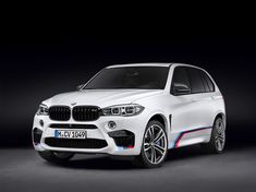 the new bmw x5 m sport utility vehicle is shown in this image, it appears to be white