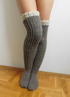 the legs of a woman wearing gray socks