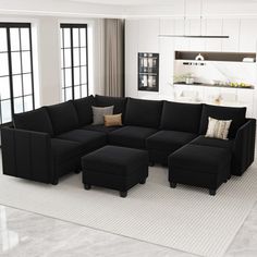 a large black sectional couch in a living room