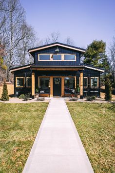 a house with a walkway leading to the front door