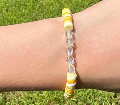 Cute yellow and white beaded bracelet. These are high quality handmade bracelets. They are made with an elastic string so will fit lots of sizes. They are around 6.75 inches. Please note that each braclet will have a very similar beading pattern but not exactly identical. Adjustable Hypoallergenic Yellow Beaded Bracelet, Yellow Beaded Stretch Bracelet For Friendship, Yellow Stretch Bracelet With Faceted Beads For Gift, White Friendship Bracelets With Faceted Round Beads, Adjustable Yellow Faceted Beads Stretch Bracelet, Casual Yellow Beaded Bracelets With 8mm Beads, Casual White Beaded Bracelets With Faceted Beads, Casual Yellow Beaded Bracelet With 8mm Beads, Adjustable Yellow Stretch Bracelet With Round Beads