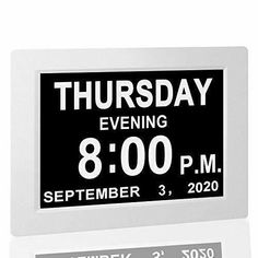 a black and white clock with the date 8 00 pm