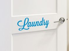 a door handle with the word laundry on it and blue lettering that reads'laundry '