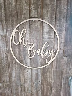 a wooden sign that says oh baby on it