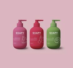 three bottles of soap on a pink and green background with the words soapy written in white