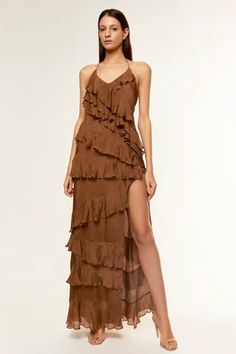 Brown chiffon gown with halter V neck, side high slit and layered ruffle panels.
Components: 1
Pattern: Plain
Neckline: Halter V Neck
Sleeve Type: Sleeveless
Fabric: Chiffon
Color: Brown
Other Details: 
Backless gown
Back tie-up
Occasion: Party,Cocktail - Aza Fashions Brown Ruffle Dress, Brown Chiffon Dress, Brown Long Dress, Brown Dresses Formal, Ruffle Layered Dress, Layered Gown, Chiffon Ruffle Dress, Chiffon Long Dress, Backless Gown