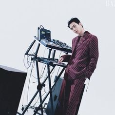 a man standing in front of a dj's equipment