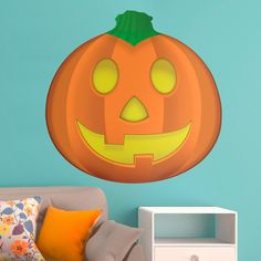 a halloween pumpkin wall decal with glowing eyes and a jack - o'- lantern on it