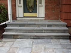 steps leading up to the front door of a house