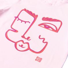 a pink t - shirt with an image of a woman's face on it