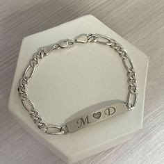 Personalized nameplate bracelet in sterling silver. We can engrave names, initials or any words that you would like on top of or even inside the bracelet. These bar bracelets are very cute and durable. The chain style is Figaro chain Surprise your loved ones with a great gift for his birthday, Christmas, Father's Day, or any other occasion. It takes 14 to 21 business days ♥ The most unique jewelry you can find, perfect gift for you and your loved one. ♥ All our jewelry is custom made by hand wit Luxury Initials Bracelet For Anniversary, Silver Bracelets For Men With Name, Adjustable Sterling Silver Bracelet For Anniversary, Classic Charm Bracelet With Polished Finish As Gift, Classic Polished Finish Charm Bracelet For Gift, Adjustable Polished Bracelets For Anniversary, Adjustable Polished Finish Bracelets For Anniversary, Silver Engraved Bracelets For Anniversary, Sterling Silver Charm Bracelet With Initials In Silver