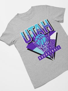 Utah Basketball 90s Throwback Unisex Shirt The unisex heavy cotton tee is the basic staple of any wardrobe. It is the foundation upon which casual fashion grows. All it needs is a personalized design to elevate things to profitability. The specially spun fibers provide a smooth surface for premium printing vividity and sharpness. No side seams mean there are no itchy interruptions under the arms. The shoulders have tape for improved durability. .: 100% cotton (fiber content may vary for different colors) .: Medium fabric (5.3 oz/yd² (180 g/m .: Classic fit .: Tear-away label .: Runs true to size Cheap Throwback Basketball T-shirt, 90s Throwback, Retro Sports, Retro Football, Unisex Shirt, Cotton Fiber, Unisex Sweatshirt, Heavy Cotton, Cotton Tee