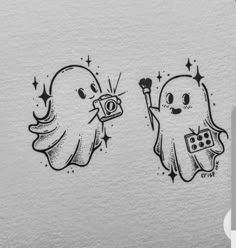 two ghost stickers with one holding a camera and the other pointing at something in its hand