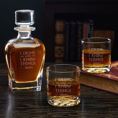 an american jones whiskey bottle and two glasses on a table next to some old books