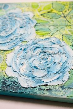 an abstract painting with blue flowers on green and white paper, painted in acrylic paint