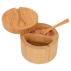 two wooden containers with spoons in them and some food inside the container, on a white background