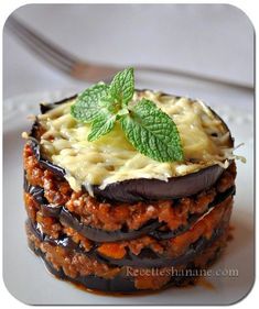 an image of a dessert with chocolate and cheese on it's crusts, topped with mint leaves