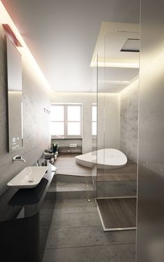 a bathroom with a glass walled shower stall and white sink on the counter, along with a large round bathtub