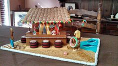 a decorated gingerbread house on top of a table