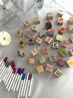 several wooden blocks and markers on a table