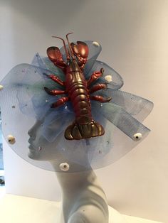 Sea food Festival- Lobster Festival - Lobster Hat- Beach Headpiece- Wedding - Shell headband- Beach headpiece- Mermaid costume Hello, This fascinator can be worn at a beach wedding, birthday, Derby ,or for a mermaid costume. It's made with a plastic Lobster and real shells. It is 2 inches high and diameter is 10 inches wide. One of a kind...each one is a little different. Netting (with tiny shells all over it) a is shown in blue like water but can be in other colors....just ask. It's lobster is Mermaid Costume, Headpiece Wedding, Horse Hair, How To Make Hair, Food Festival, Other Colors, Hair Pieces, Fascinator, Headpiece