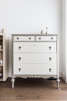 a white chest of drawers in a room