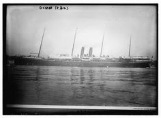 an old black and white photo of a large ship in the water with tall masts