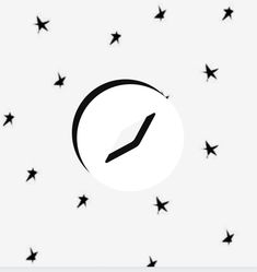 a black and white clock surrounded by stars