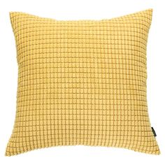 a yellow pillow with small squares on the front and back, against a white background